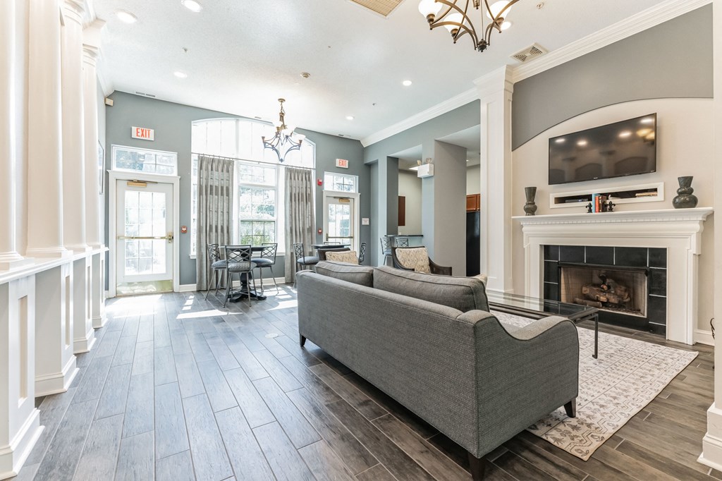a living room with a couch and a fireplace  at Cumberland Crossing, Cumberland, Rhode Island