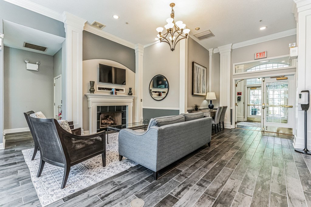 a living room with couches and chairs and a fireplace  at Cumberland Crossing, Cumberland, RI
