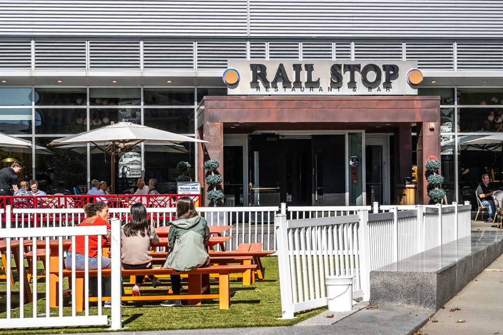 People sitting on benches outside at The Indie, Massachusetts  