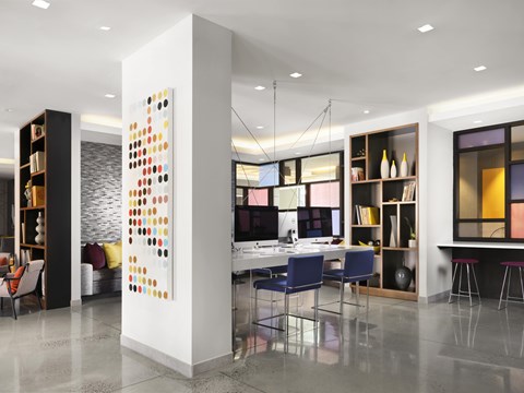 A modern office space with a white column and a colorful artwork.
