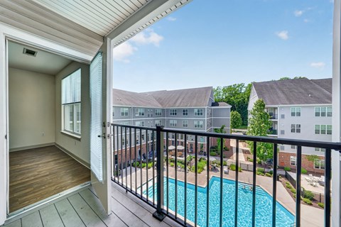 A balcony and a view of the pool at 1 Kennedy Flats, Danbury, CT.