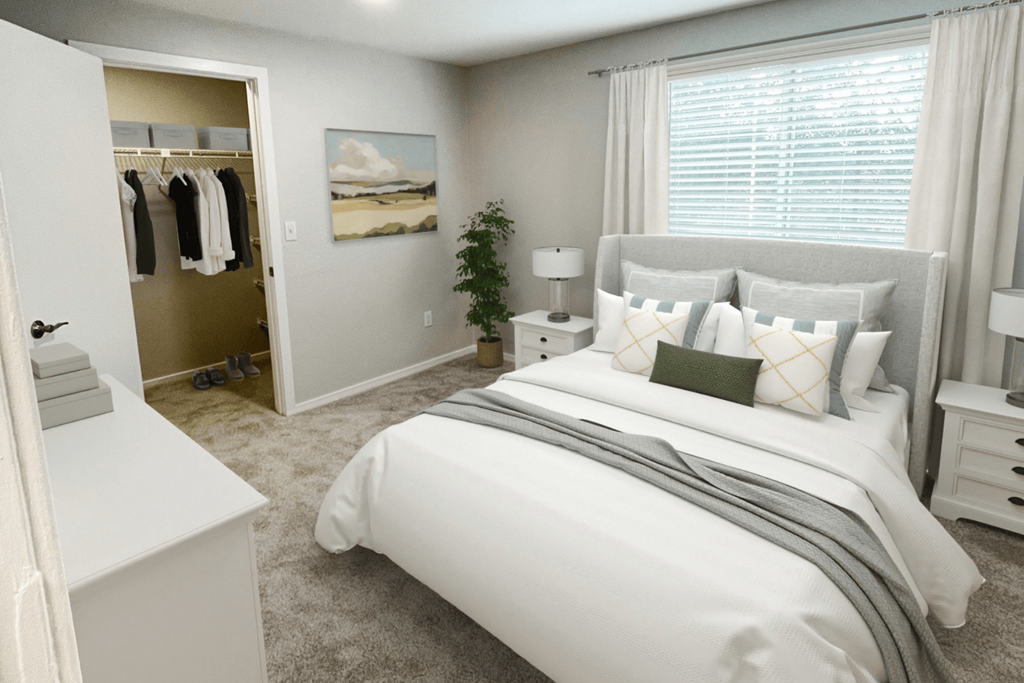 a bedroom with a large window and white furniture at The Meadows, Massachusetts