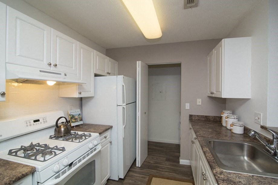 Galley Kitchen with White Cabinets at Town Walk at Hamden Hills, Hamden, CT, 06518