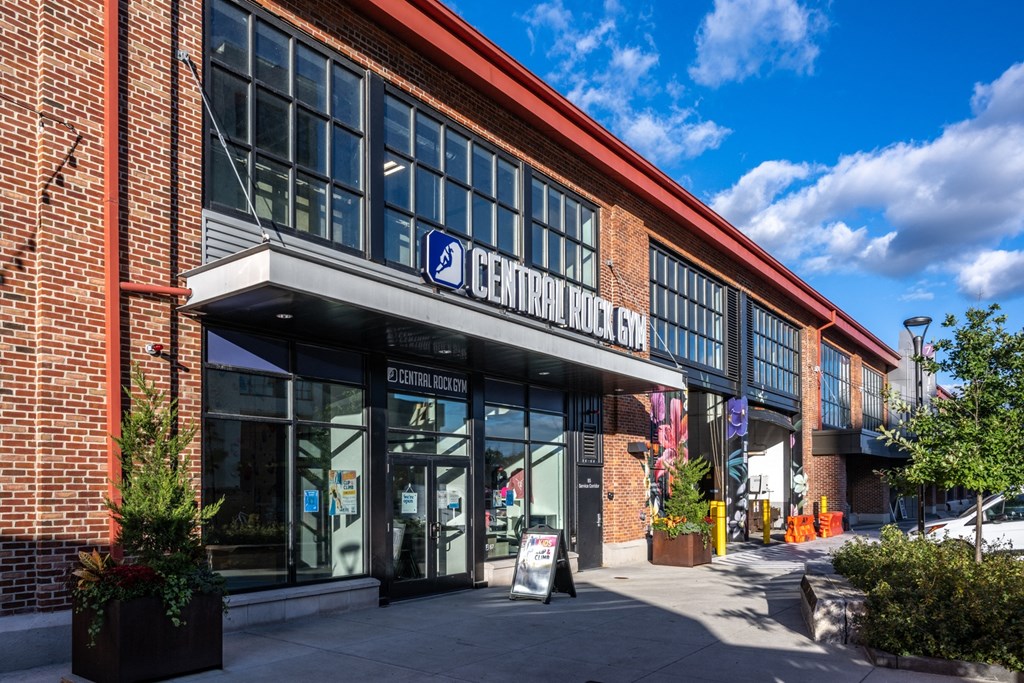 the front of a brick building with a sign that reads central market at The Indie, Massachusetts  