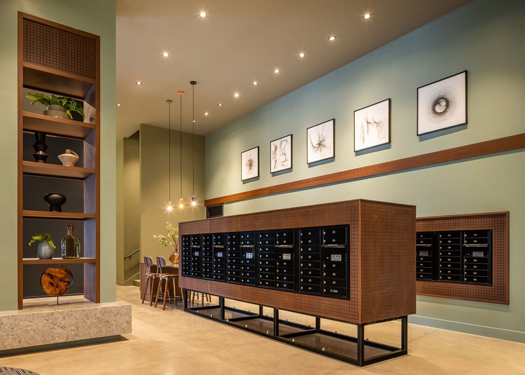 A room with a large wooden cabinet and a shelf with plants and vases.