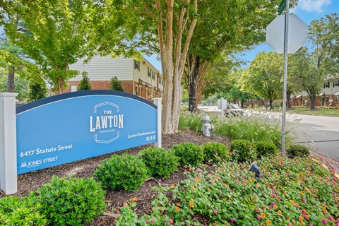A blue sign with white text that says "The Lawton" on it.