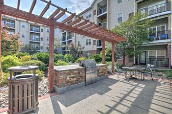 Courtyard With Outdoor Grills at Alexander at Patroon Creek, Albany