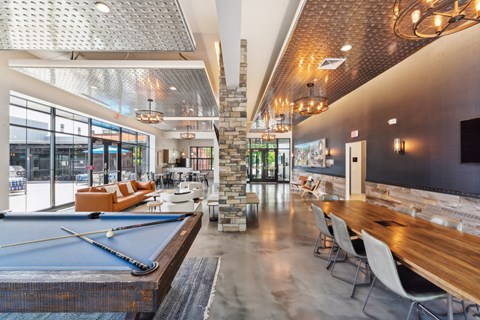 a clubhouse with a pool table and a bar with chairs at The Tannery, Connecticut