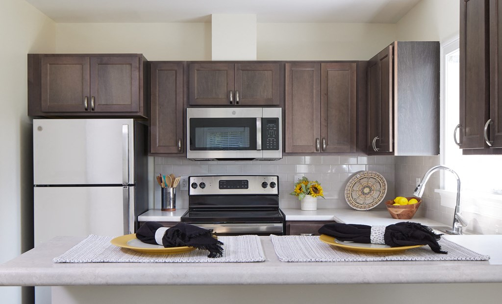 kitchen with stainless steel appliances and oak cabinets at Atlantic Pointe, Maine