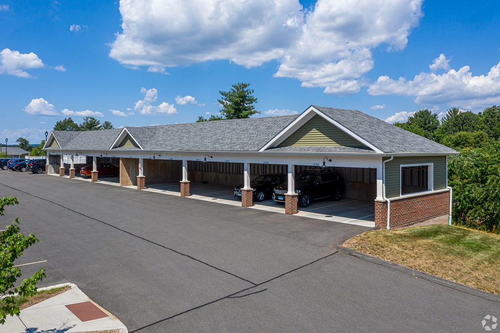 A building with a parking lot in front of it.