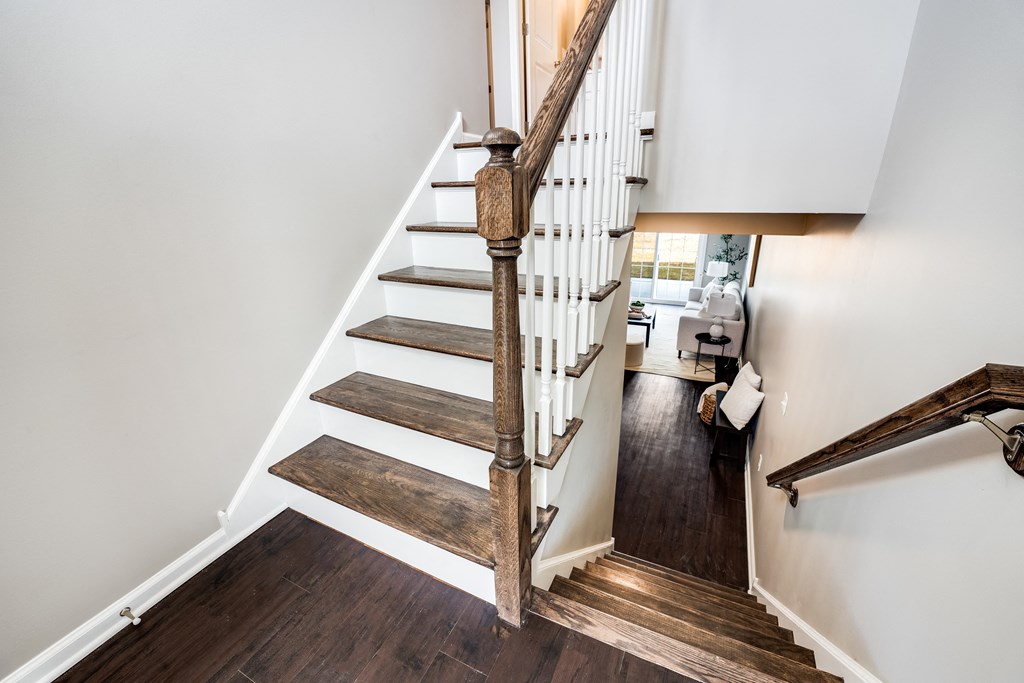 an open staircase with wooden treads and a railing up the side of a house at Pleasant View Estates, Griswold, Connecticut