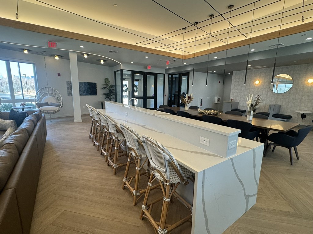 A large kitchen island with chairs for gathering