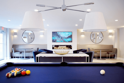 A pool table with a white ball on it.
