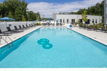 A large swimming pool with the number 8 floating in the middle.