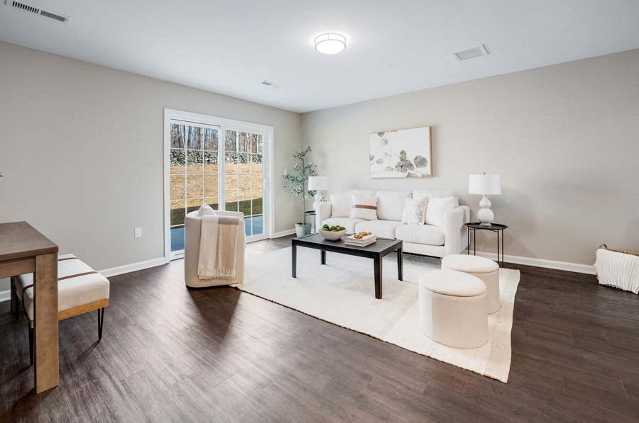 a living room with a couch and a table at Pleasant View Estates, Griswold, 06351