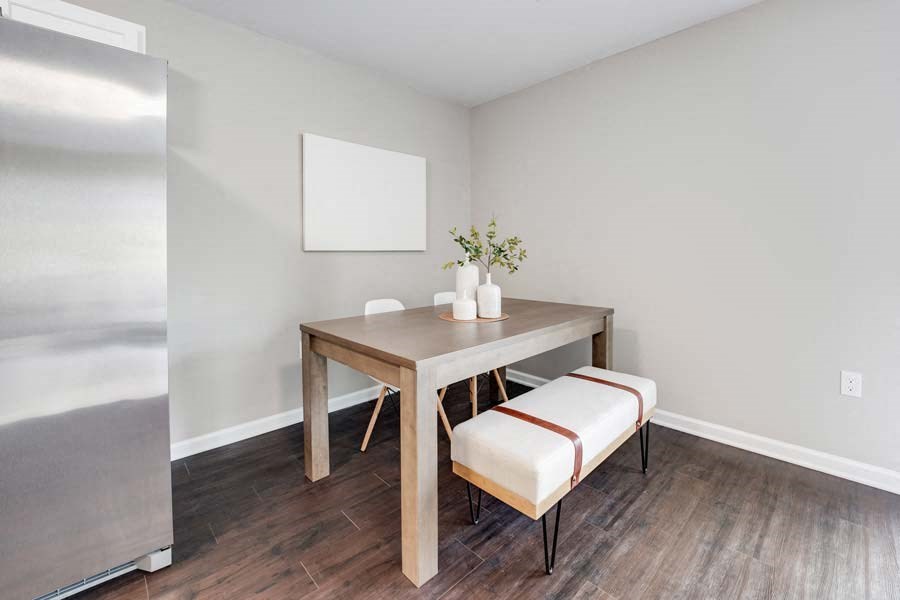 a dining room with a table and two stools at Pleasant View Estates, Griswold, Connecticut