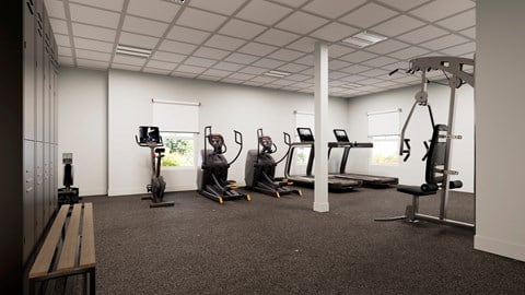 a spacious exercise room with treadmills and elliptical machines