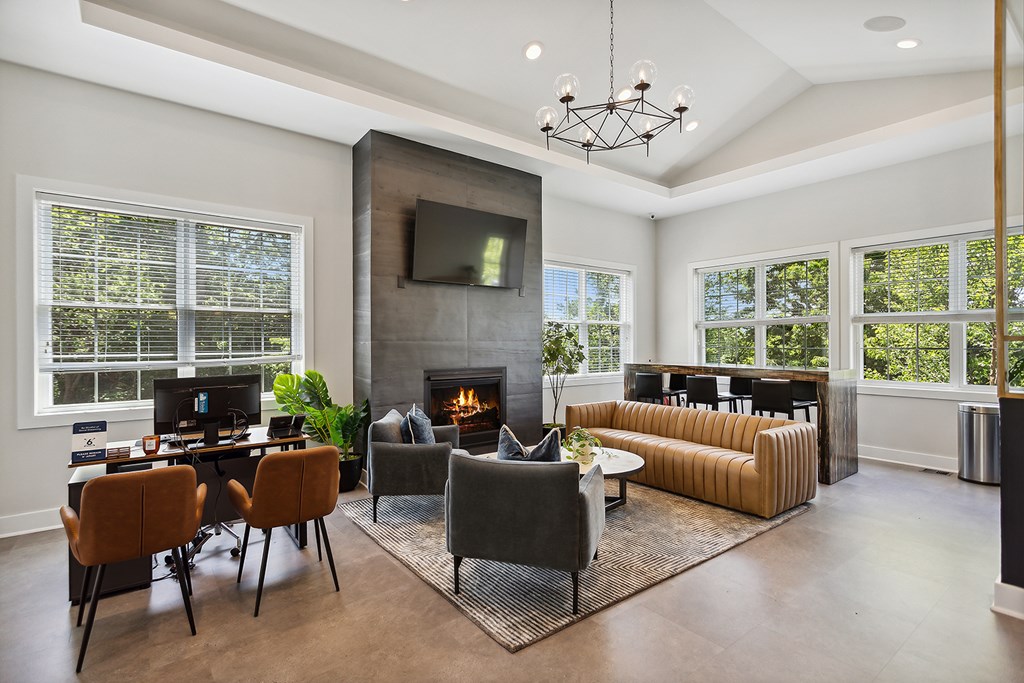 A modern living room with a fireplace and a television.