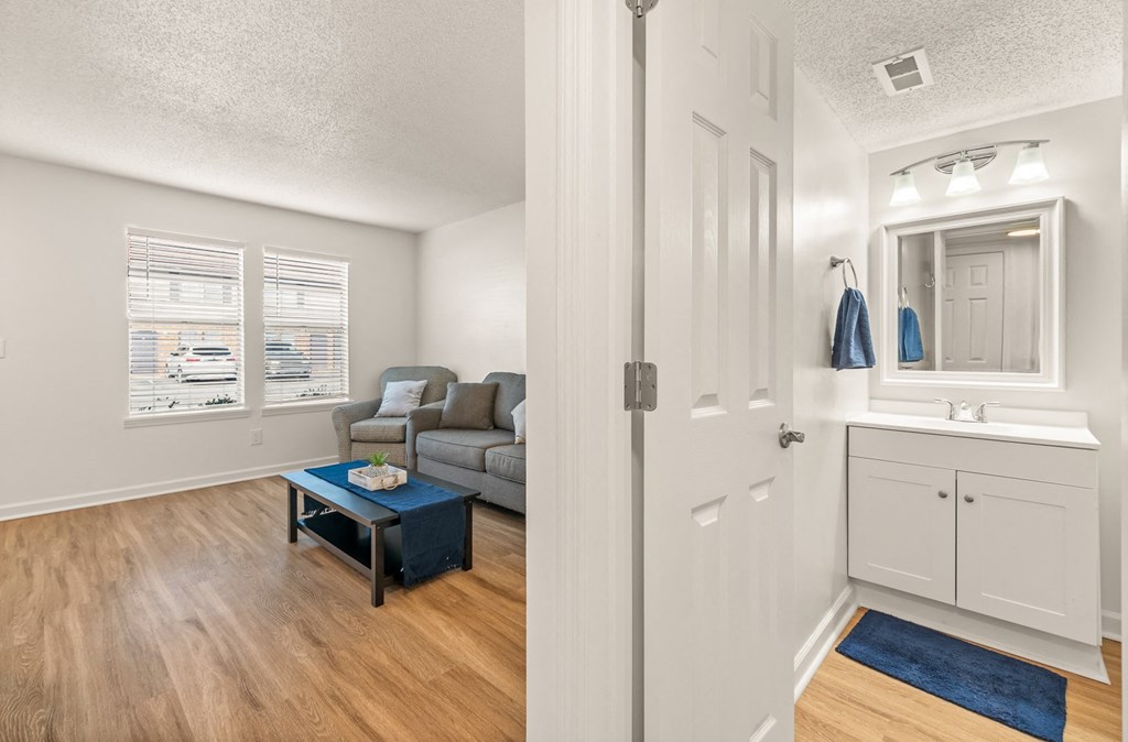 a photo of a living room and bathroom