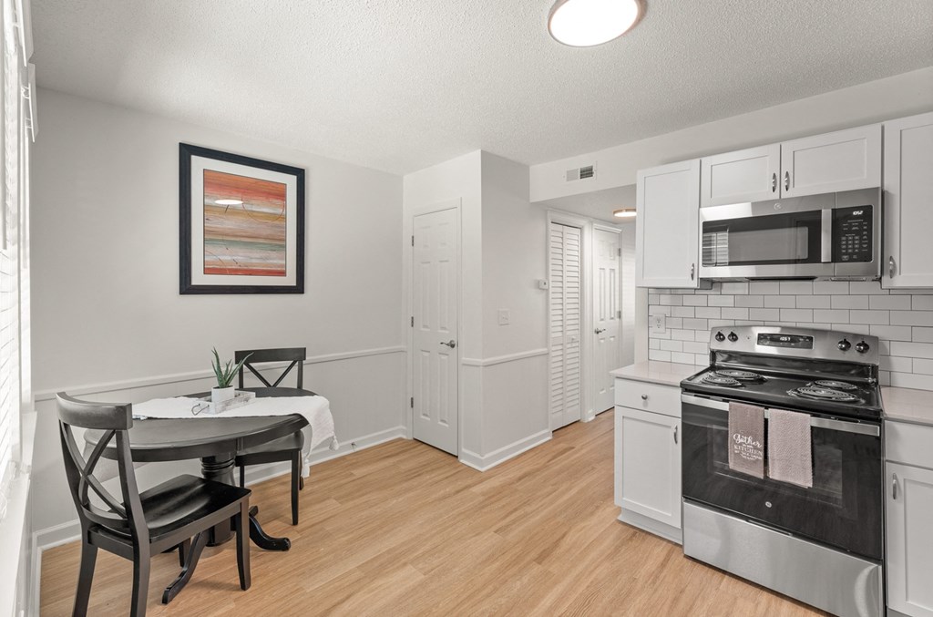a photo of a kitchen and dining room