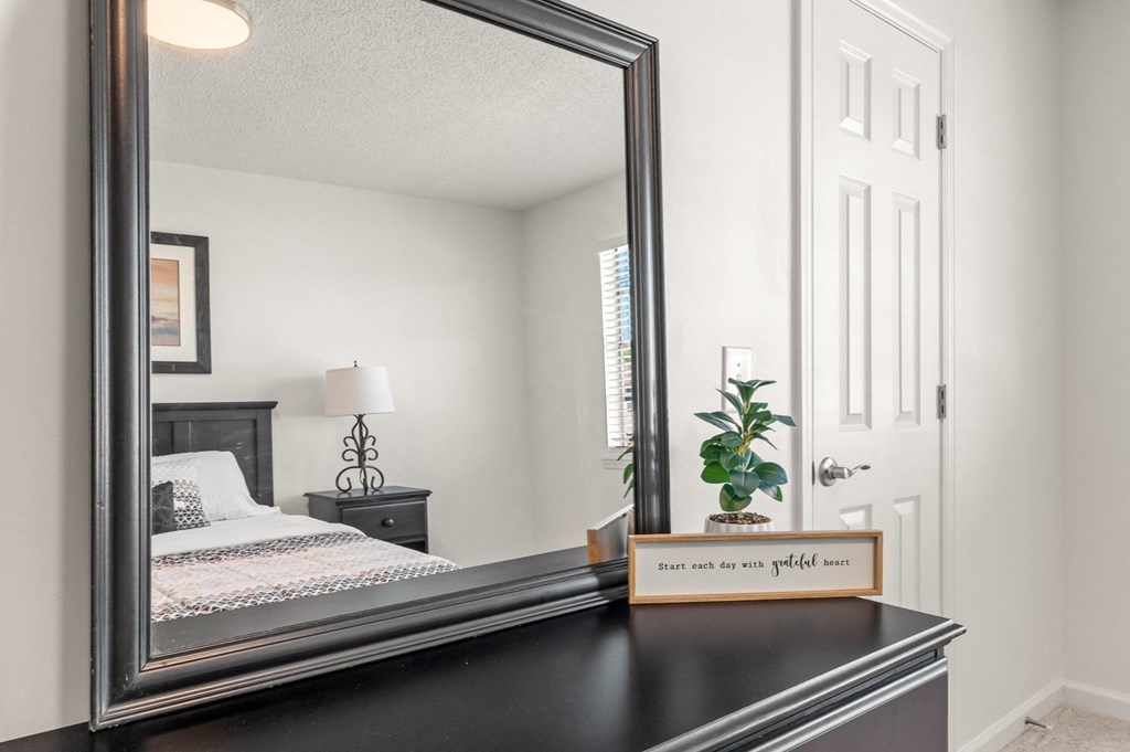 a photo of a mirror in a bedroom