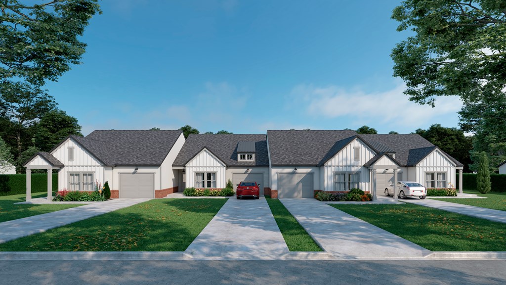 A row of houses with a red car parked in front of the first house.