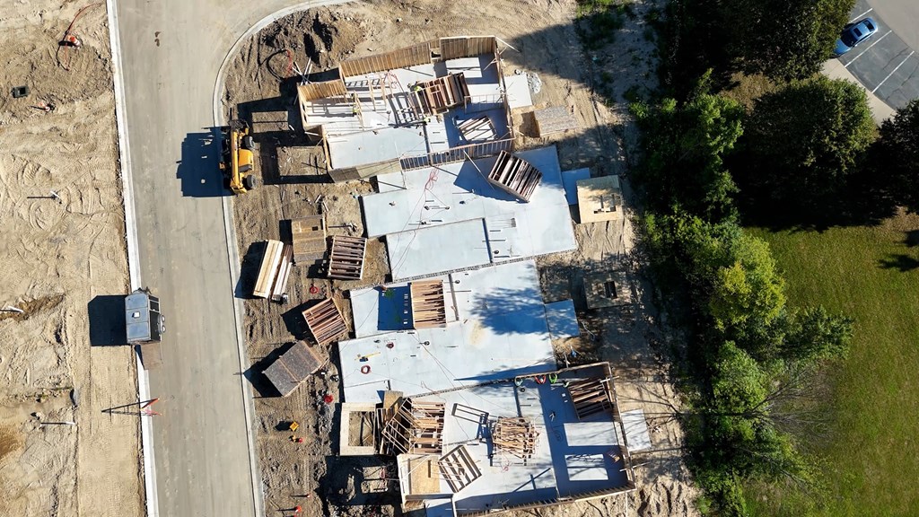 A construction site with a large building under construction.