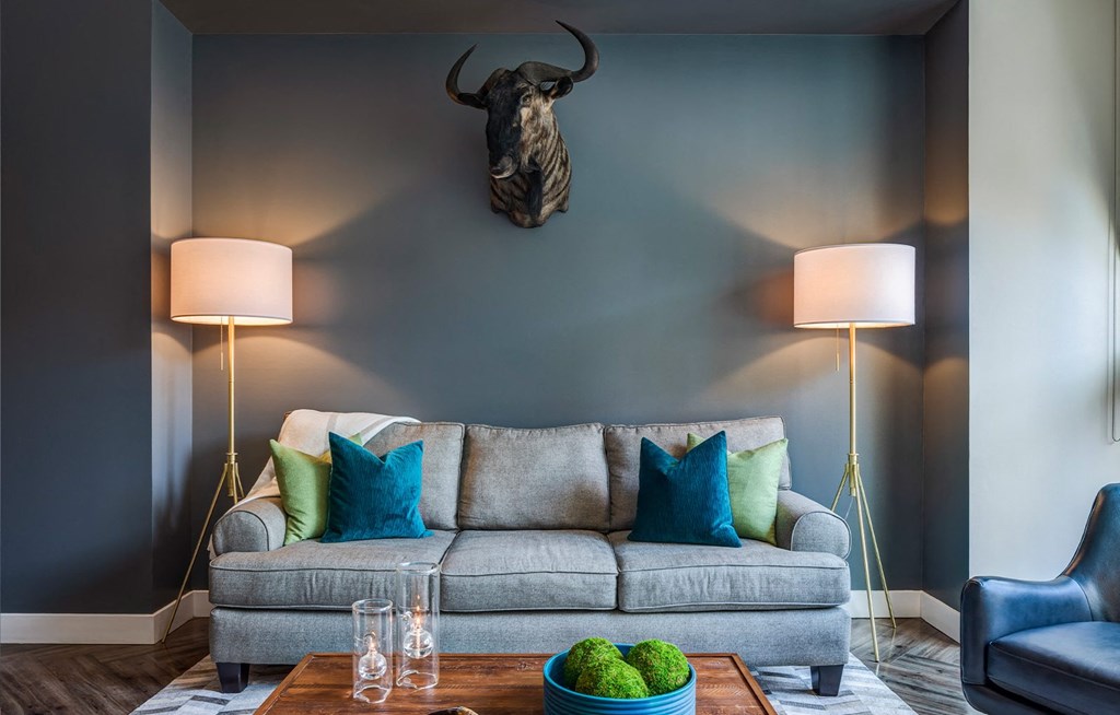 a living room with a couch and two lamps