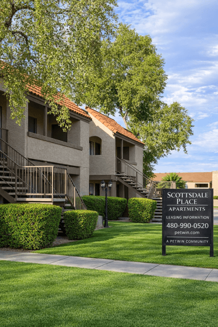 A building with a sign that says "Scottsdale Place Apartments" in front of it.