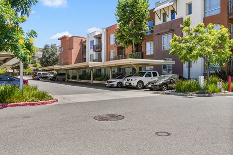a rendering of a parking lot in front of an apartment building