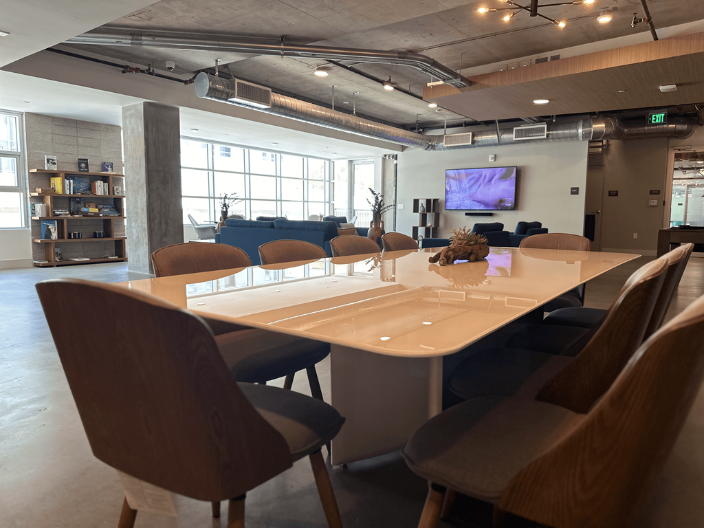 a conference room with a large table and chairs
