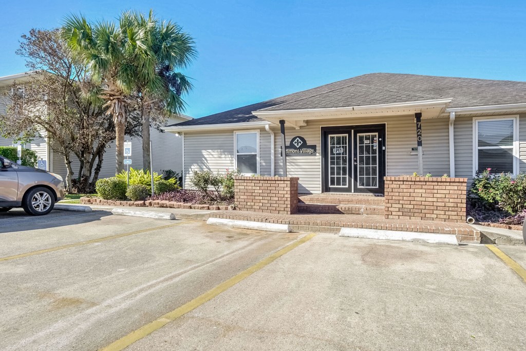 A house with a driveway in front of it.