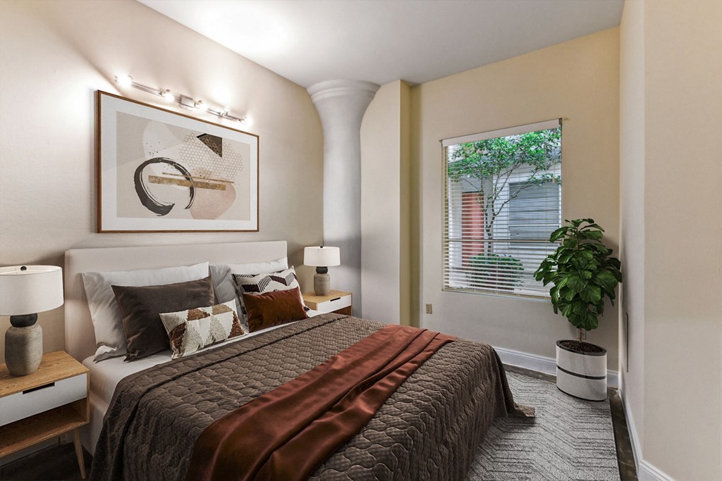 a bedroom with a bed and a window