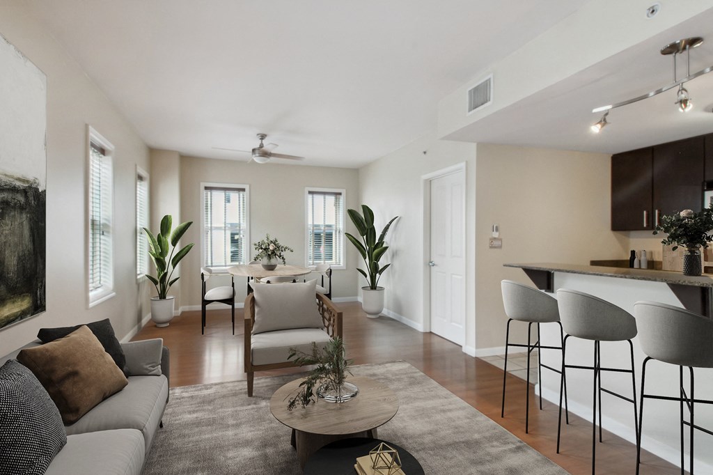 a living room with a couch and a table with chairs