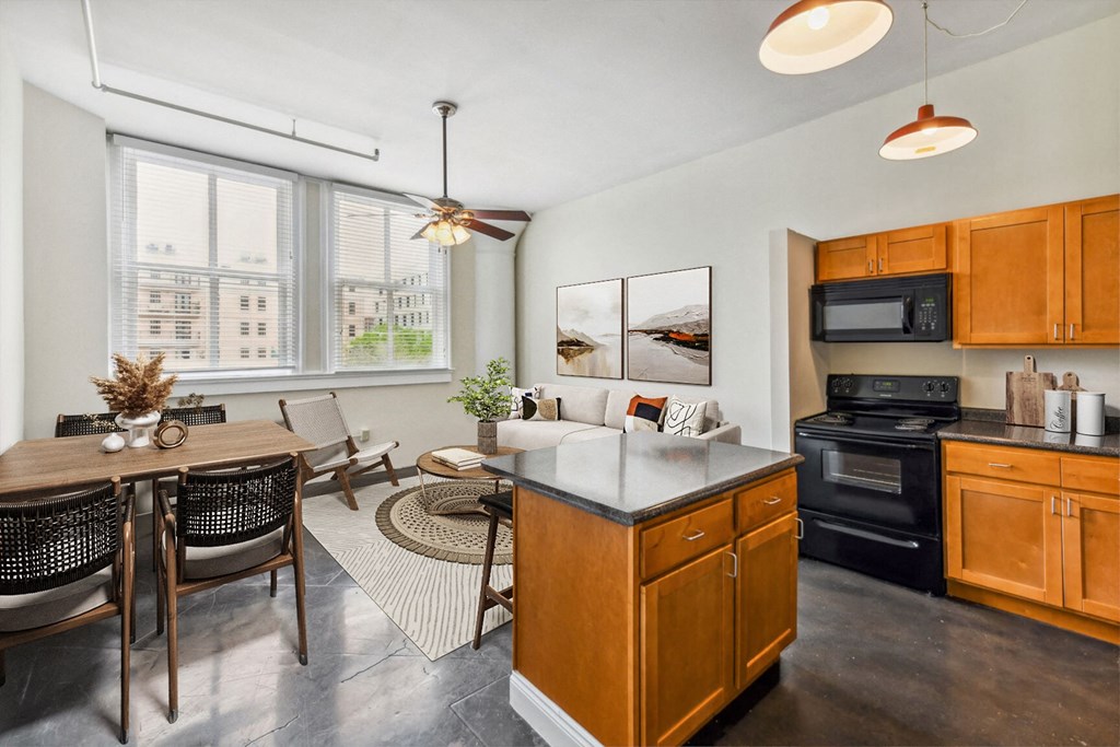 an open kitchen and dining room with a table and chairs