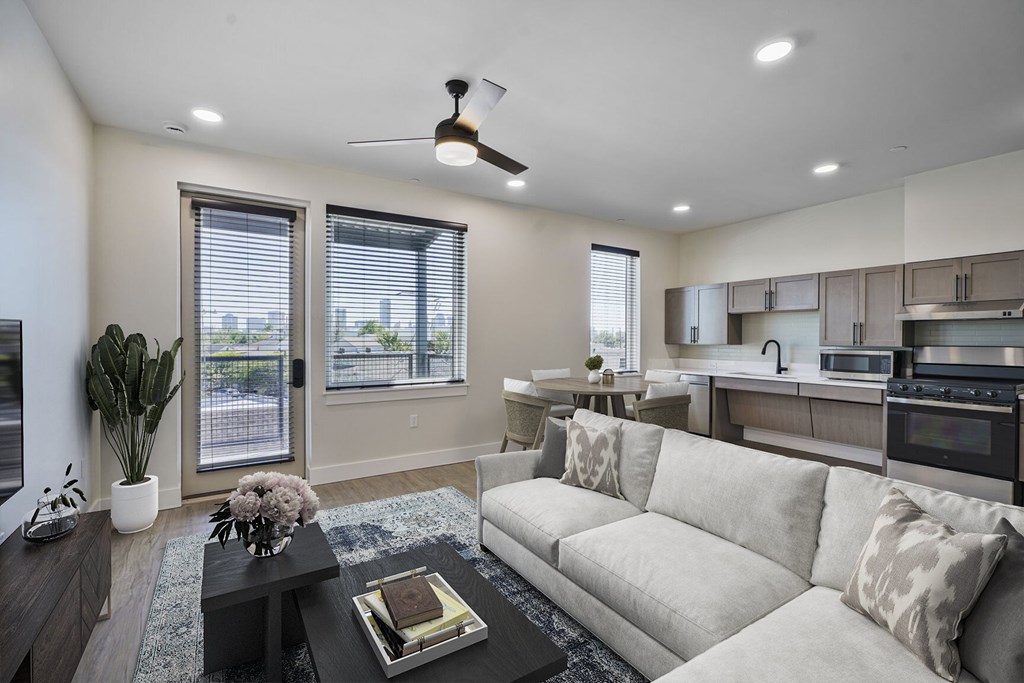 A modern living room with a large couch and a coffee table.