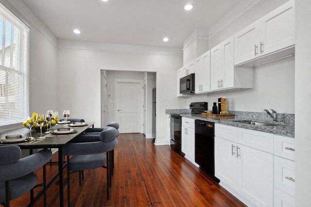 a kitchen and dining room with a table and chairs