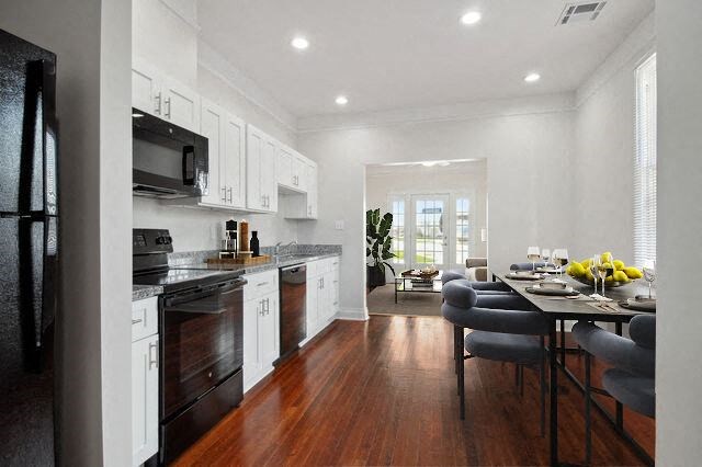 a kitchen and dining room with a table and chairs