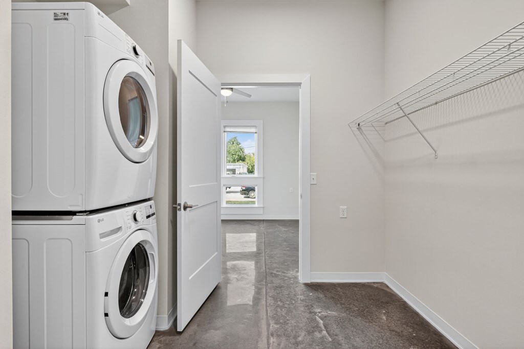 A laundry room with a washer and dryer in it.