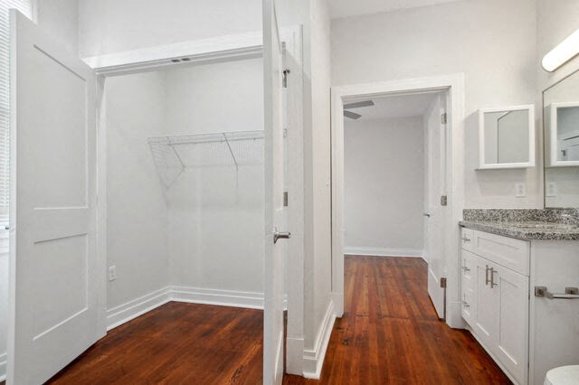 a bedroom with a closet and a door to a bathroom