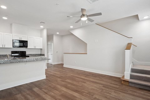 Grove Place I living room with a kitchen and a ceiling fan