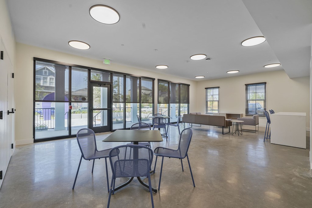 A room with a table and chairs in it.