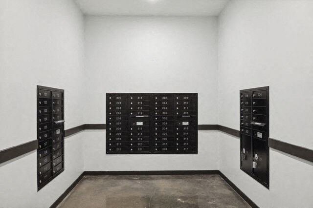 a white room with a wall with a bunch of boxes in it