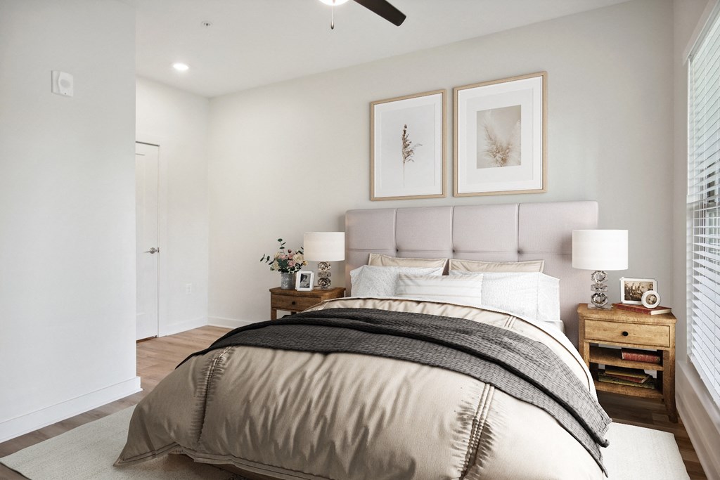 a bedroom with a large bed and a window