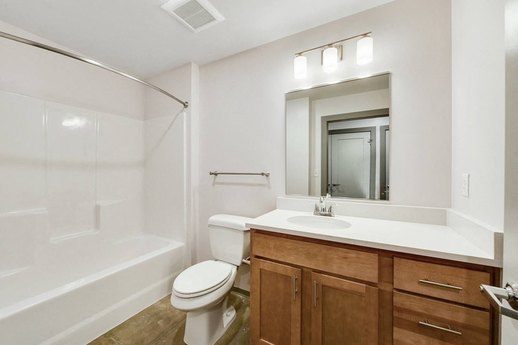 a bathroom with a sink toilet and a shower