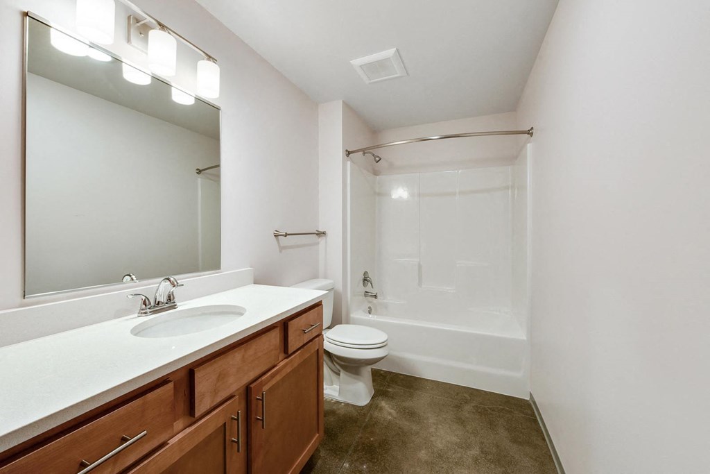 a bathroom with a sink toilet and a shower