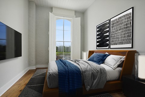 a bedroom with a bed and a window