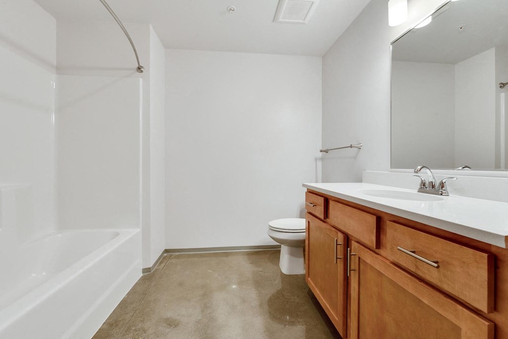 a bathroom with a sink toilet and bath tub
