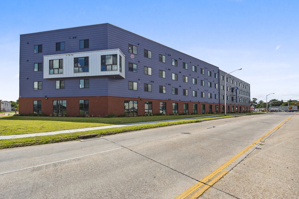 a large building with a street in front of it