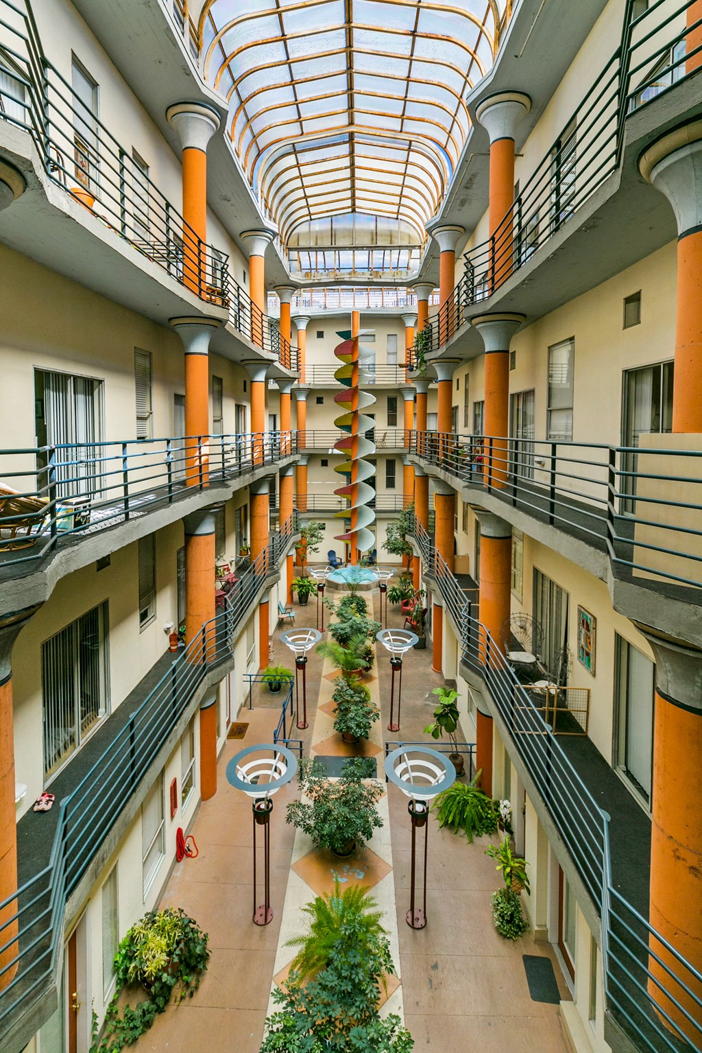 an interior view of a large building with many floors and balconies